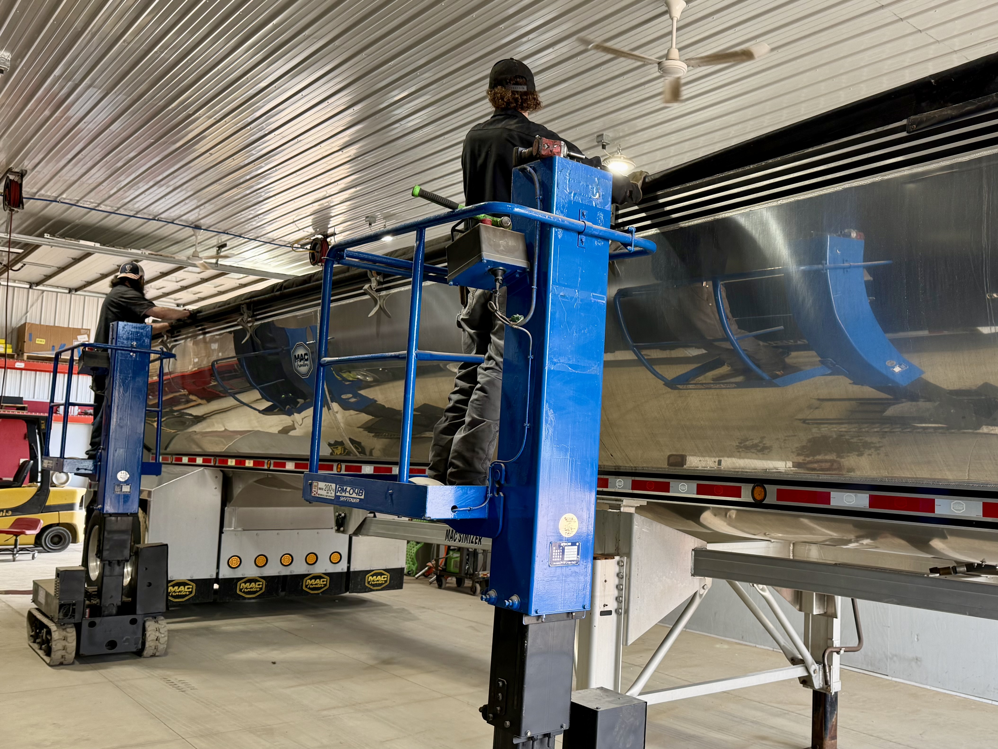 Star Trailer Sales technicians servicing a trailer in the shop